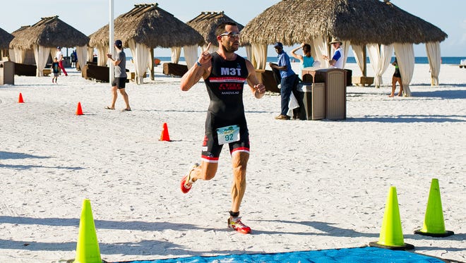 Vladimir Casanova, 40, of Miami finishes first with a time of 1:02:52 at the sixth annual Marco Island Triathlon, which took place at Marco Island on Sunday, Oct. 2, 2016.