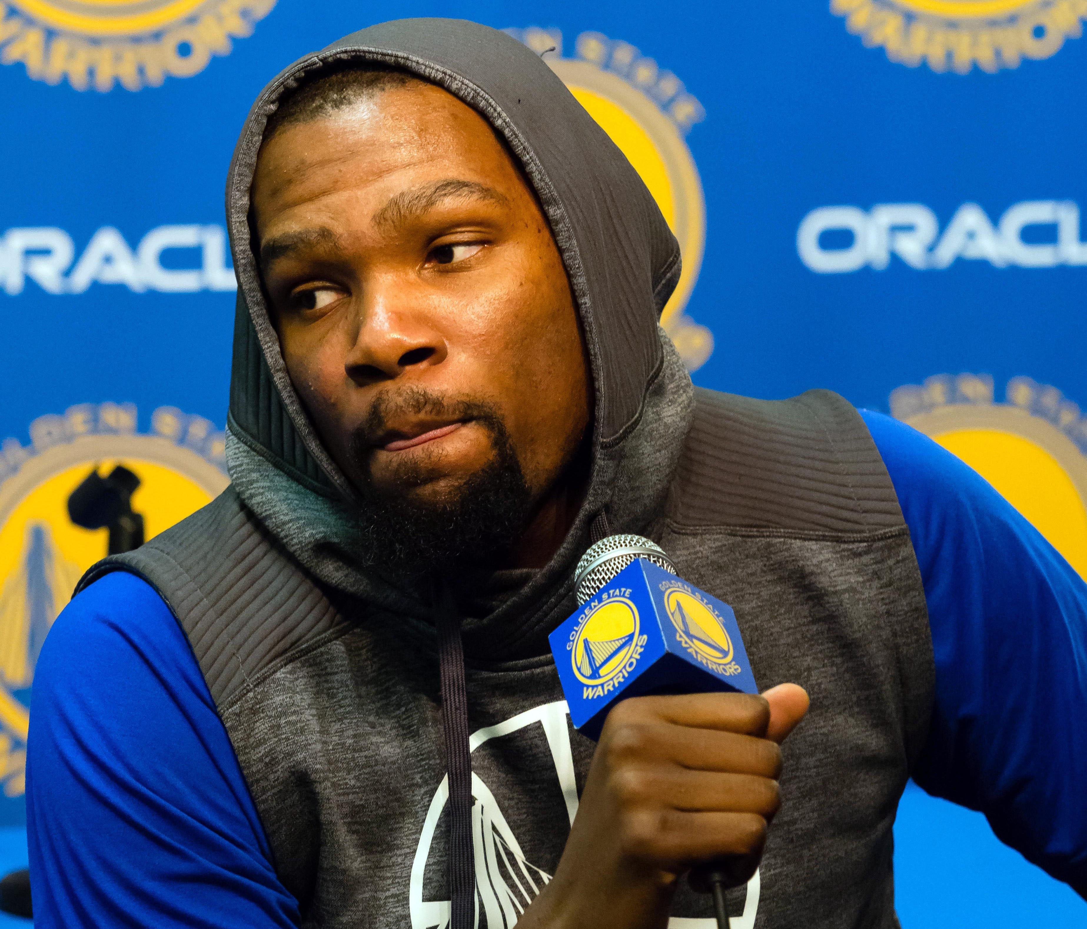 Warriors forward Kevin Durant speaks to the media about his knee injury before Golden State's game against the Boston Celtics at Oracle Arena in Oakland.