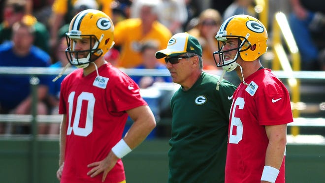 Green Bay Packers offensive coordinator Tom Clements with quarterbacks Matt Flynn, left, and Scott Tolzien, during training camp practice at Ray Nitschke Field.