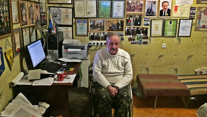 Sergey Krasilnikov, 65, in his apartment in Kiev on Feb. 29.