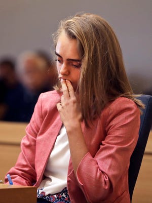 Defendant Michelle Carter listens as prosecutor Maryclare Flynn makes her opening statement Tuesday, June 6, 2017, in Taunton, Mass. Carter is charged with manslaughter for allegedly using text messages to encourage her boyfriend, Conrad Roy III, 18, to kill himself.