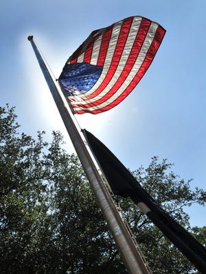 The American flag at the Wichita County Courthouse flew at half-staff, Tuesday after President Trump ordered the flags to be lowered to honor the five victims of the Capital Gazette newspaper shooting in Annapolis, MD.