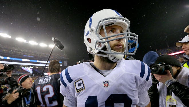 Colts quarterback Andrew Luck walks away from Patriots quarterback Tom Brady after the AFC Championship Game Sunday.
