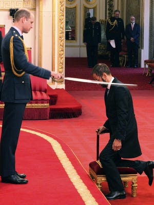 Former Beatle Ringo Starr, is made a knight by Britain's Prince William at Buckingham Palace during an Investiture ceremony in London Tuesday March 20, 2018.