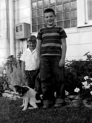 Bob and Ginny hang out with the family pooch in this photo from 1952.