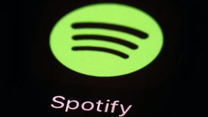 This March 20, 2018 file photo shows the Spotify app on an iPad in Baltimore. Music site Spotify has complained to European Union regulators about Apple, saying that the U.S. tech giant is abusing its dominant position in music streaming and hurting competition. Spotify founder Daniel Ek said Wednesday, March 13, 2019 that the company has filed a formal complaint with the executive European Commission against Apple.