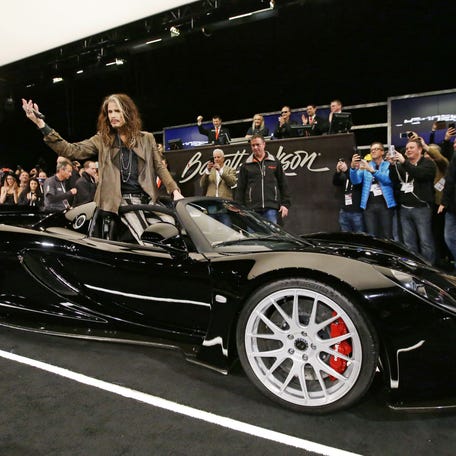 Aerosmith frontman Steven Tyler rides in on his 2012 Hennessey Venom GT Spyder, which sold for $800,000 on Jan. 20, 2017, at Barrett-Jackson Collector Car Auction at WestWorld in Scottsdale.