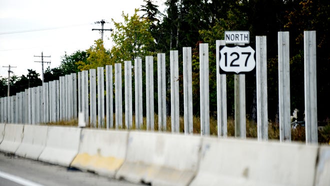 An incomplete portion of the sound wall is seen on the side of northbound US 127 on Tuesday, Sept. 5, 2017, in Lansing near the Saginaw Street on ramp. Construction of the wall won't resume until October. [Nick King/Lansing State Journal]