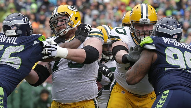 Green Bay Packers' Bryan Bulaga and T.J. Lang block in the third quarter against the Seahawks.