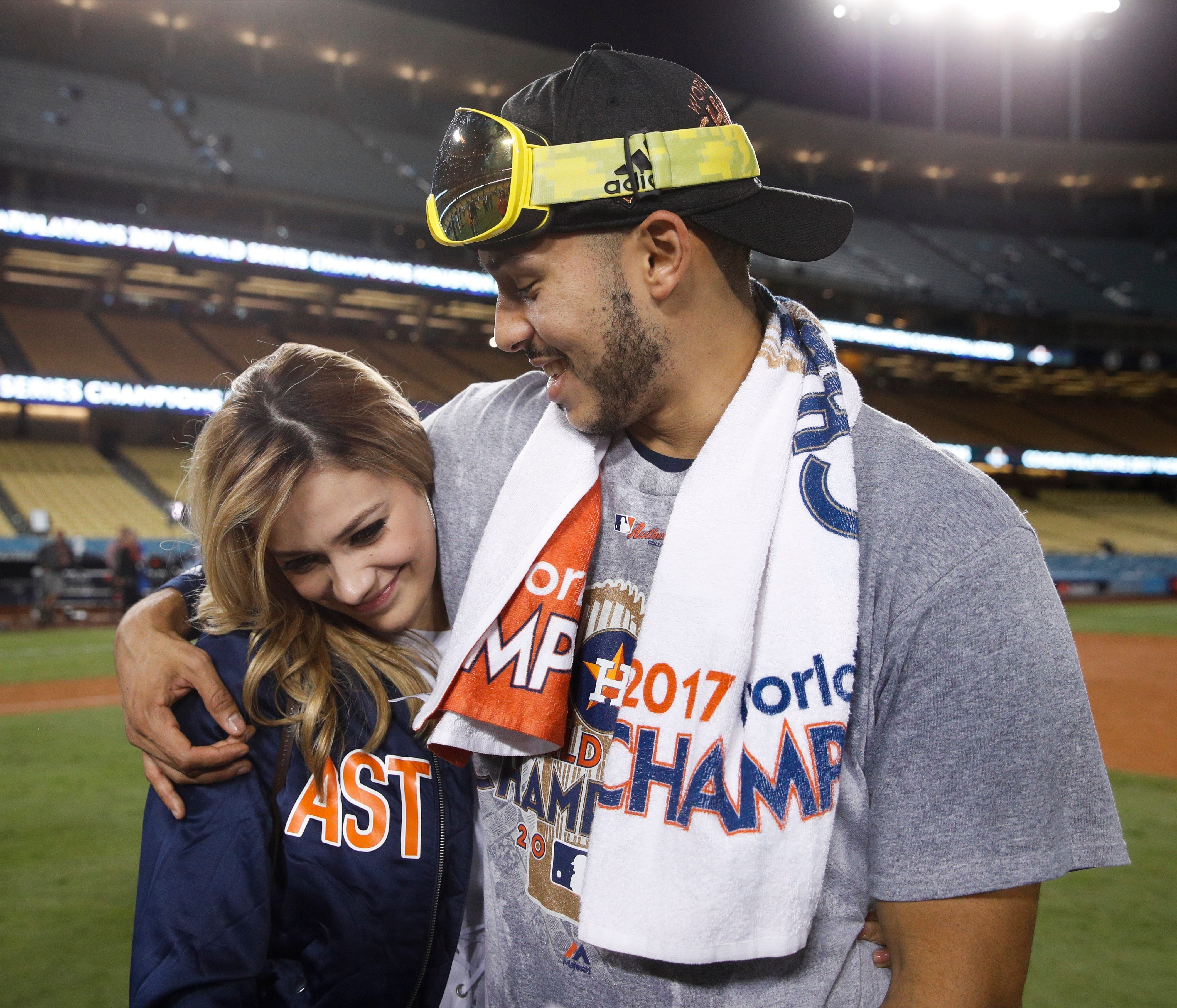 Daniella Rodriguez, former Miss Texas, talks to Houston Astros' Carlos Correa after Game 7 of baseball's World Series Wednesday, Nov. 1, 2017, in Los Angeles. The Astros won 5-1 to win the series 4-3. Correa proposed to Rodriguez after the game. (AP 