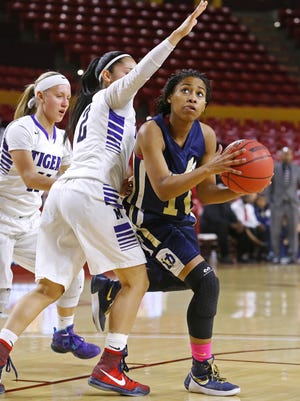 Desert Vista's Tatum Brimley  looks to shoot over Millennium's Raina Perez in the second half of their Division I girls basketball state tournament quarterfinal game at Wells Fargo Arena on Tuesday.