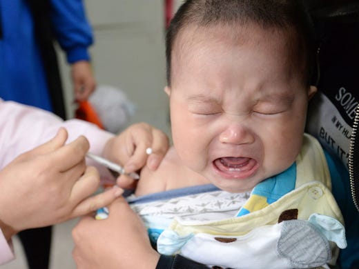 A child receives a vaccination during China's National