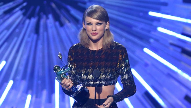 Taylor Swift accepts the award for female video of the year for 'Blank Space' at the MTV Video Music Awards. She also won Video of the Year for 'Bad Blood.'