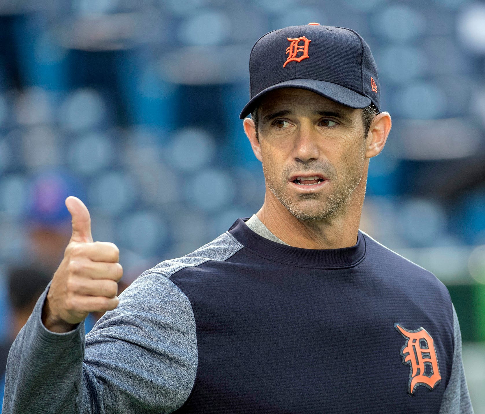 Tigers manager Brad Ausmus (7) gestures with his thumb during batting practice before a game on Friday, Sept. 8, 2017, in Toronto.