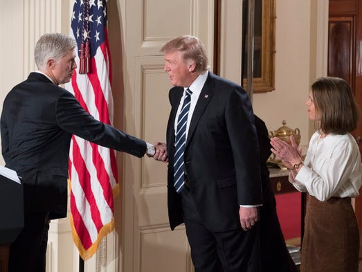 Trump shakes hands with Neil Gorsuch, his Supreme Court