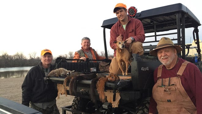 Squirrel hunters (from left) Jim Walker of Madison, Chip Tatum of Hattiesburg, Jeremy Shook on Brandon and Keith Landrum of Ovett were hunting along the Mississippi River when Walker discovered a mysterious candle that was used to cast a love spell.