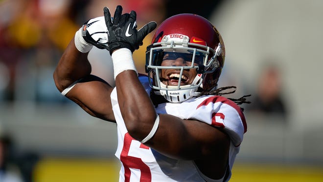 Josh Shaw of the USC Trojans celebrates after returning a blocked punt for a touchdown against the California Golden Bears during the second quarter at California Memorial Stadium on November 9, 2013 in Berkeley, California.