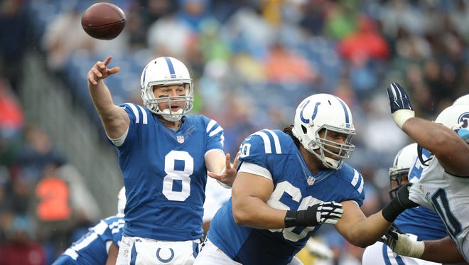 Indianapolis Colts quarterback Matt Hasselbeck passes behind the protection of guard Lance Louis in the second half against the Titans. Indianapolis traveled to Nashville for their final regular season game Sunday, December 28, 2014. 