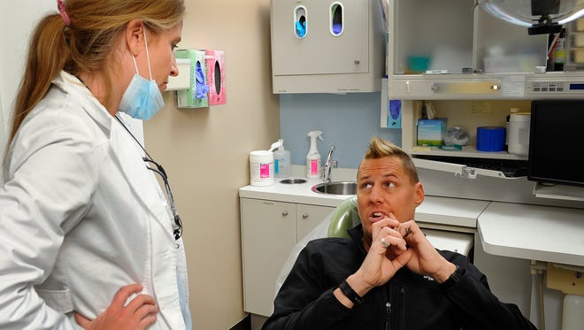 Chris Orsburn talks with dentist Laurie Carlisle about future dental work he needs to have done at the Interfaith Dental Clinic Thursday Dec. 15, 2016, in Nashville, Tenn.