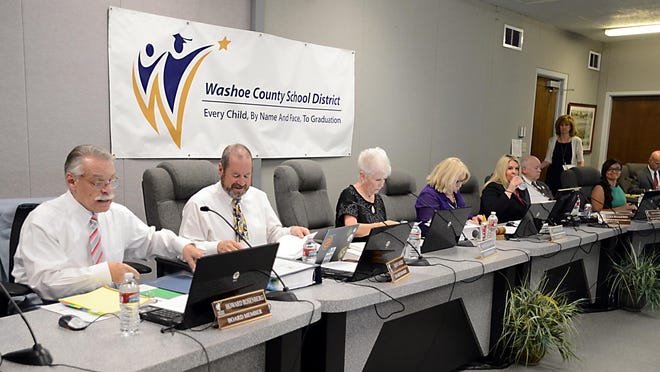 
Washoe County School Board members, left to right, Howard Rosenberg, Dave Aiazzi, Barbara McLaury, Barbara Clark, Lisa Ruggerio, John Mayer and Estela Gutierrez, converse during a meeting. On the far right is Randy Drake, the board’s attorney. 
