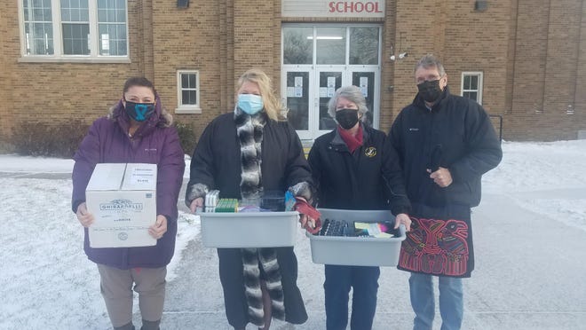 The Chippewa County Sunrise Rotary Club delivered art supplies to St. Mary's School art teacher, Michelle Breen, second from left. The members selected this community project to benefit 130 youth after hearing there was a dire need for such supplies. Club members included, (from left) Betsy Huggett, Sherry Demaray and Ken Demaray.