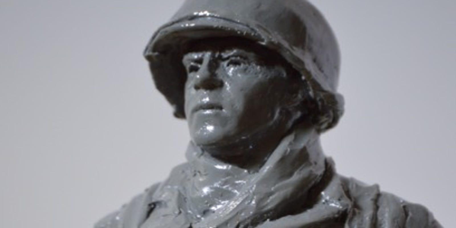 World War Ii Hero Being Honored With Wall Statue