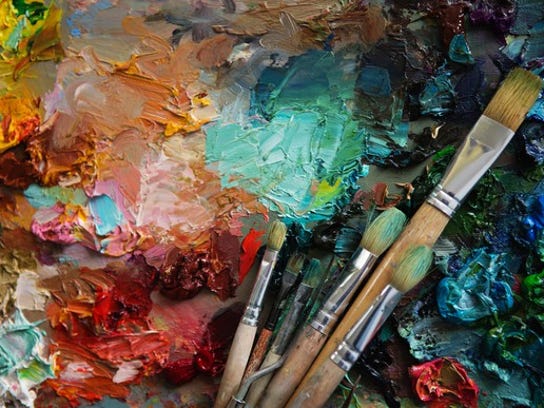 A palette of paints and brushes