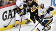 Pittsburgh Penguins defenseman Ron Hainsey (65) tries