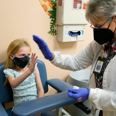 Livia Carbino, 8, gets a high five from her grandm