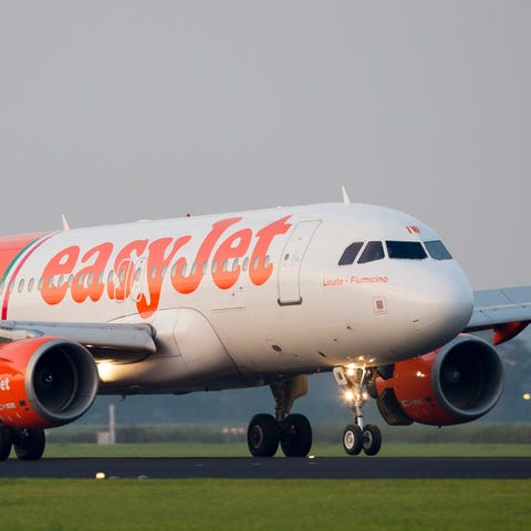An easyJet Airbus lands at Amsterdam Schiphol Inte