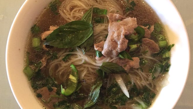 Our columnists finds the broth in the flank steak and meatball pho at SF Kitchen to be strangely bland.