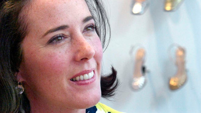 In this May 13, 2004 file photo, designer Kate Spade poses with shoes from her next collection in New York.