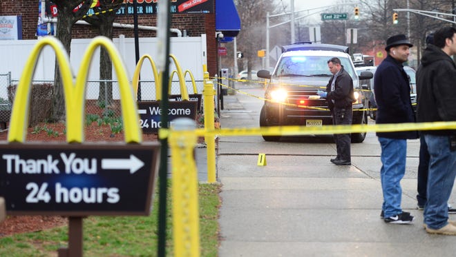 Paterson Police investigate a fatal shooting at the McDonalds on the corner of Broadway and Madison Avenue on Tuesday morning.