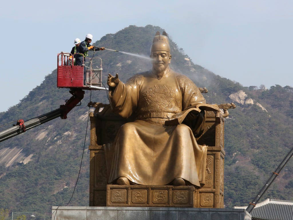 A worker sprays water onto the statue of King Sejong for a spring cleaning at the Gwanghwamun Plaza in Seoul. King Sejong, the fourth king of the Joseon Dynasty (1392-1910), created the Korean alphabet, Hangul, in 1446.