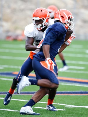 Defensive back Devin Cockrell applies pressure against a teammate during practice Tuesday morning as the team prepares for NMSU in both schools' season opener.
