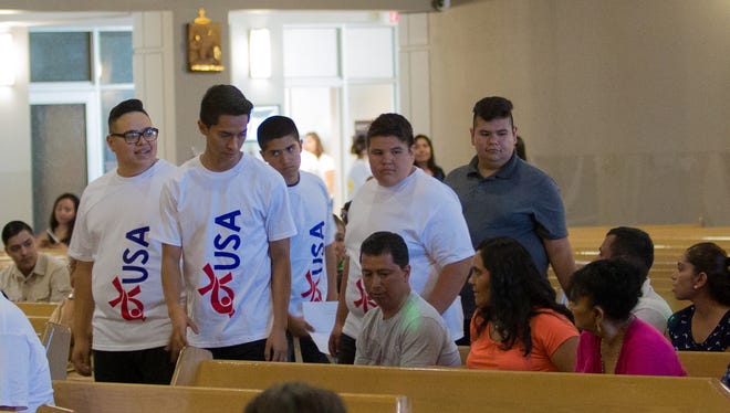 Youths going to Poland for the World Youth Day event gather to celebrate a send-off Mass on Tuesday at Corpus Christi Catholic Church in the Lower Valley.