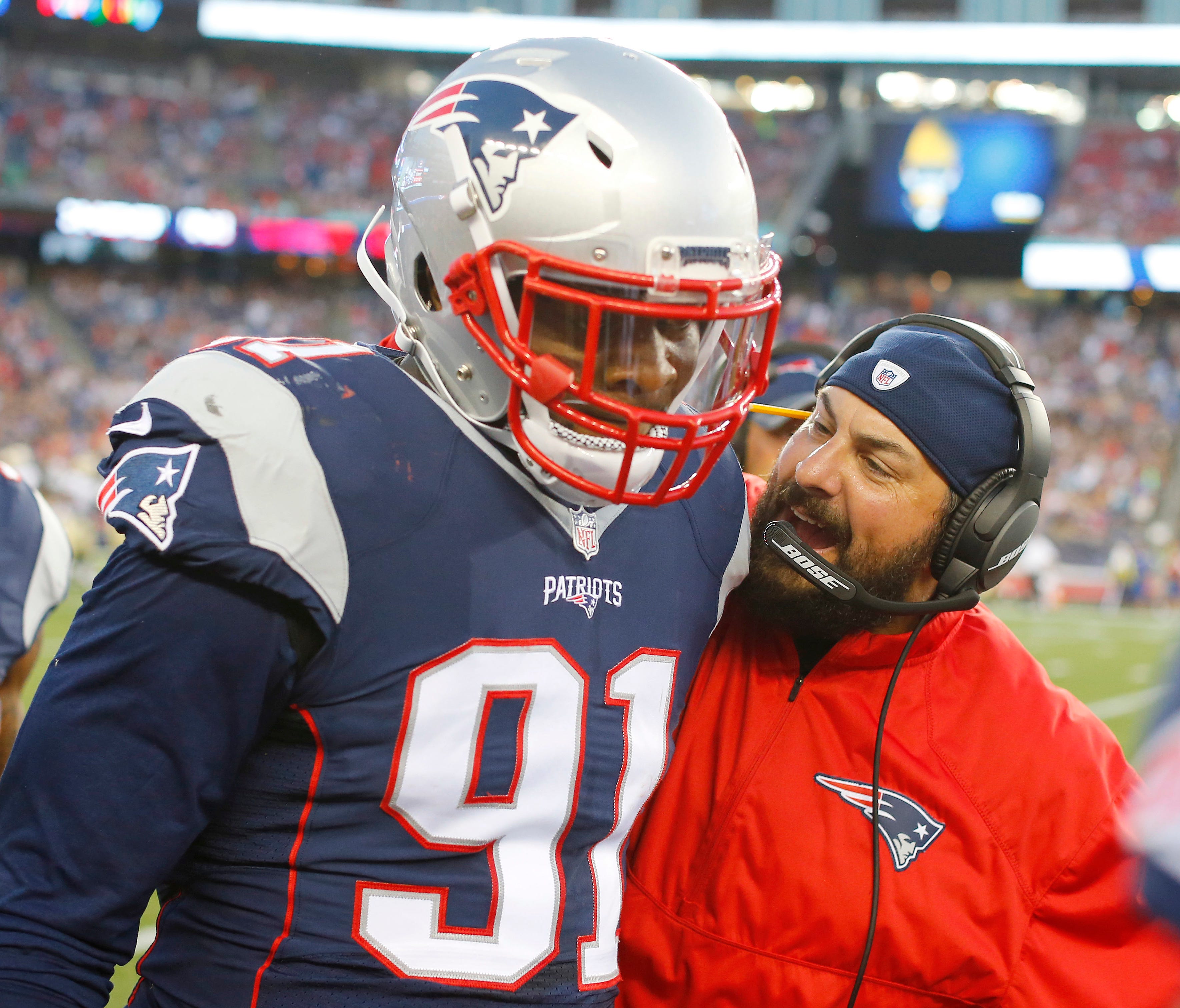 Patriots defensive coordinator Matt Patricia congratulates linebacker Jamie Collins, who scored a touchdown on an interception against the Saints in a preseason game Aug. 11, 2016 in Foxborough, Mass.