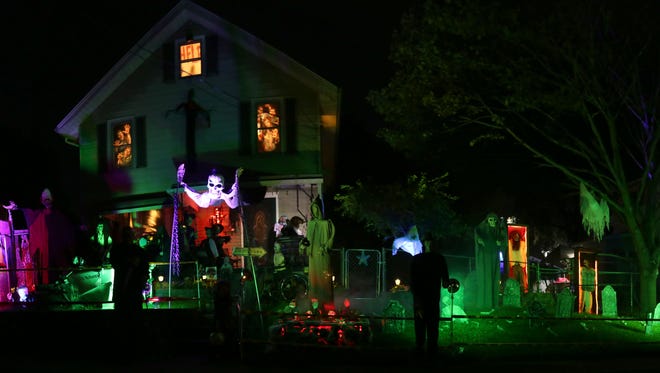 Ryan McKenna has decorated his house on Henry Street for Halloween for the past 13 years. There are moving ghouls, ghosts and many other sights.