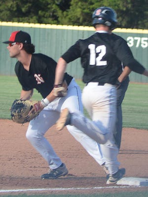 Newton Rebel first baseman Lincoln Andrews, a freshman at Southeast Missouri State, forces out a Sunflower Seed during play Monday at Klein-Scott Field.
