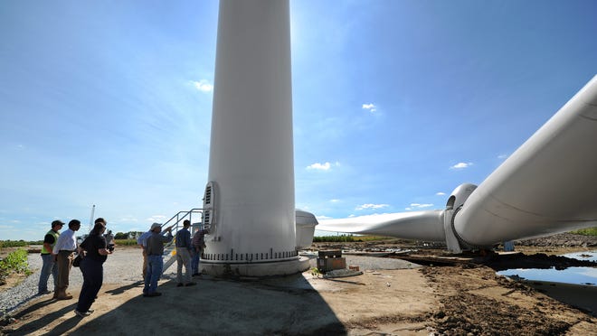 Wind turbine propellers and towers wait to be assembled in September 2012 at the E.ON Wildcat Wind Farm in Elwood.