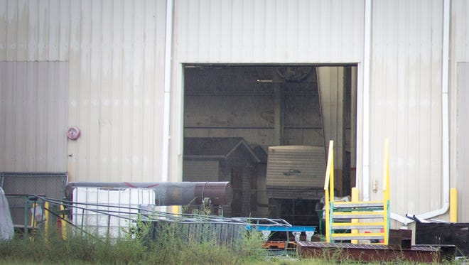 Aug. 9, 2016: Homes belonging to the deceased Rhoden family members sit inside a Waverly warehouse, with its warehouse doors opened. Three trailers and a camper were taken from Rhoden properties miles away and stored here after the April 22 slaying of eight people in Pike County, Ohio.