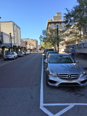 Cars parked on Third Street in downtown Alexandria.