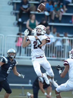 Henderson County's Max Hargis (24) nearly comes up with an interception against Reitz at the Reitz Bowl Friday night.
