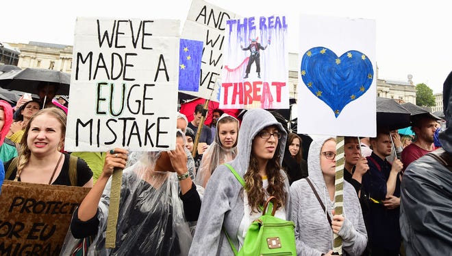 Supporters hold banners during a pro-EU rally Tuesday in Trafalgar Square in London.
