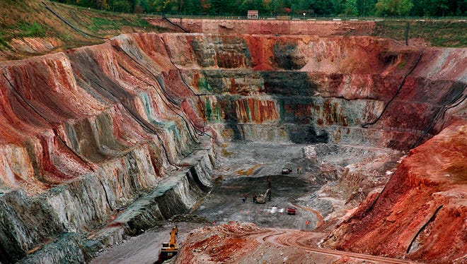 File - In this September 1996, file photo, the Flambeau open pit copper mine is viewed in Ladysmith, Wis. Four years after relaxing the state's iron mining laws, Wisconsin Republicans are pushing to lift a moratorium on copper and gold mining, a ban Gov. Scott Walker helped impose as a legislator. Wisconsin law requires sulfide mining applicants to prove a similar mine has operated for 10 years and been closed for 10 years without polluting. No companies have provided any examples.