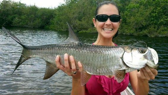 PIC OF THE WEEK: Sara Hallas used small Mayan cichlids to catch and release two tarpon while canoeing in creeks off the Caloosahatchee River, with her friend, Cody Pierce.