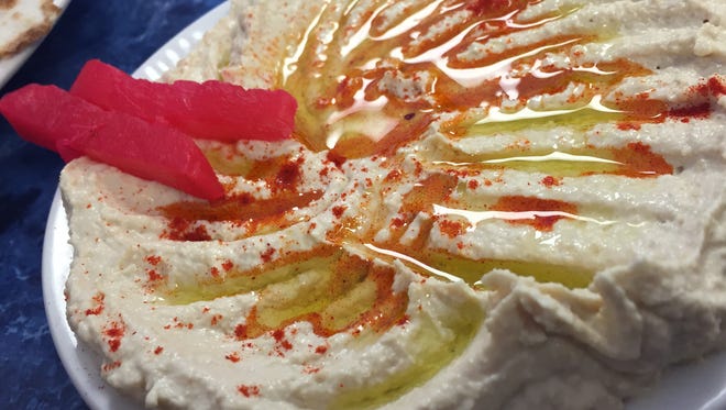 The Al-Rayan Yemeni menu offers a fine hummus, creamy and glistening with olive oil.