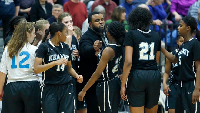 Bishop Kearney head coach Kevan Sheppard calls the team together during a game against Mercy in the third quarter at Rush-Henrietta High School last season.