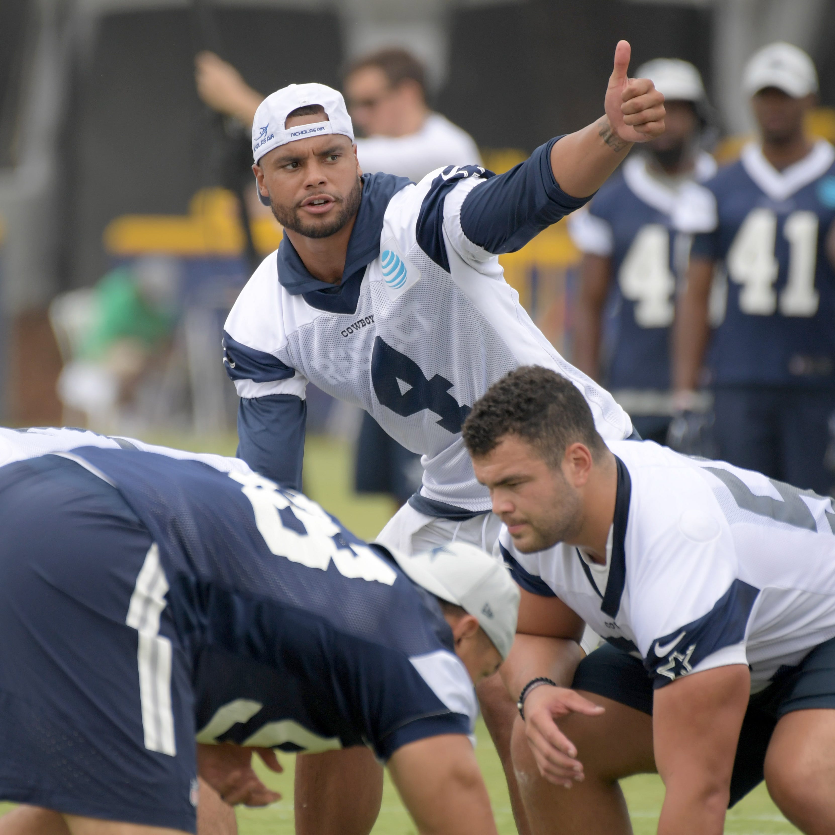 Dallas Cowboys quarterback Dak Prescott (4) gestures during training camp at River Ridge Fields in July.