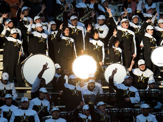 The Vanderbilt marching band cheers in the stands during